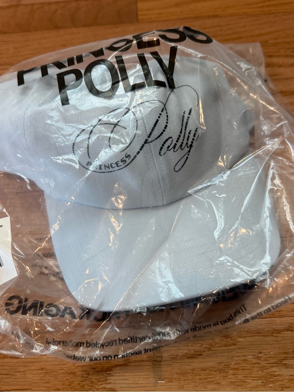 New in packaging Princess Polly blue/grey Baseball Cap with Black Script Logo